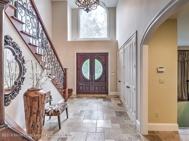 19 Russell Road Freehold, NJ 07728 - Photo 5 of 68 a view of an entryway with a door and a rug