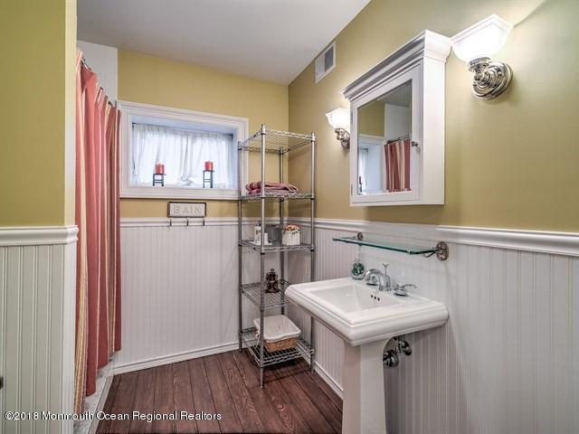 19 Russell Road Freehold, NJ 07728 - Photo 43 of 68 a kitchen with a sink cabinets and wooden floor