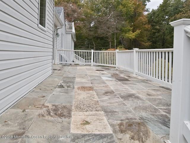 19 Russell Road Freehold, NJ 07728 - Photo 44 of 68 a view of a yard with wooden fence