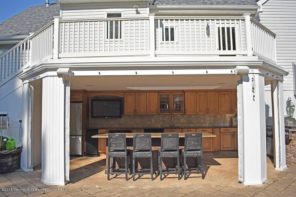 19 Russell Road Freehold, NJ 07728 - Photo 45 of 68 a view of a house with dining table and chairs