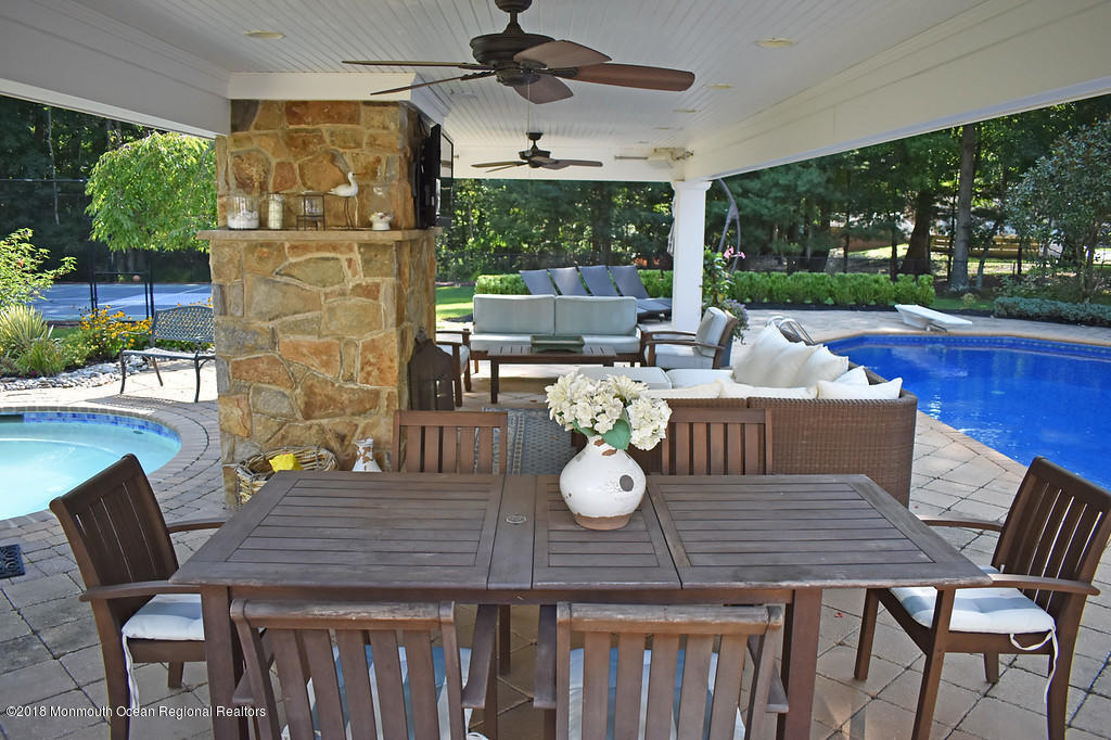 19 Russell Road Freehold, NJ 07728 - Photo 54 of 68 a view of a dining table and chairs in the patio