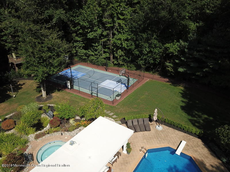 19 Russell Road Freehold, NJ 07728 - Photo 57 of 68 an aerial view of a house with garden space and lake view