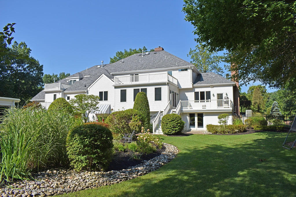 19 Russell Road Freehold, NJ 07728 - Photo 66 of 68 a front view of a house with a yard