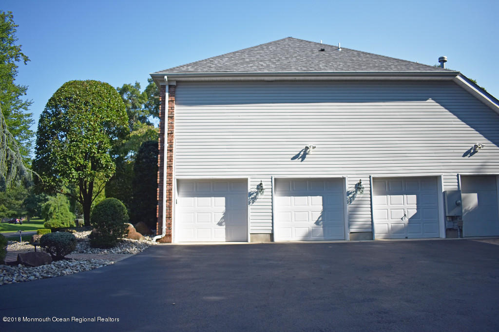 19 Russell Road Freehold, NJ 07728 - Photo 67 of 68 a front view of a house with a yard