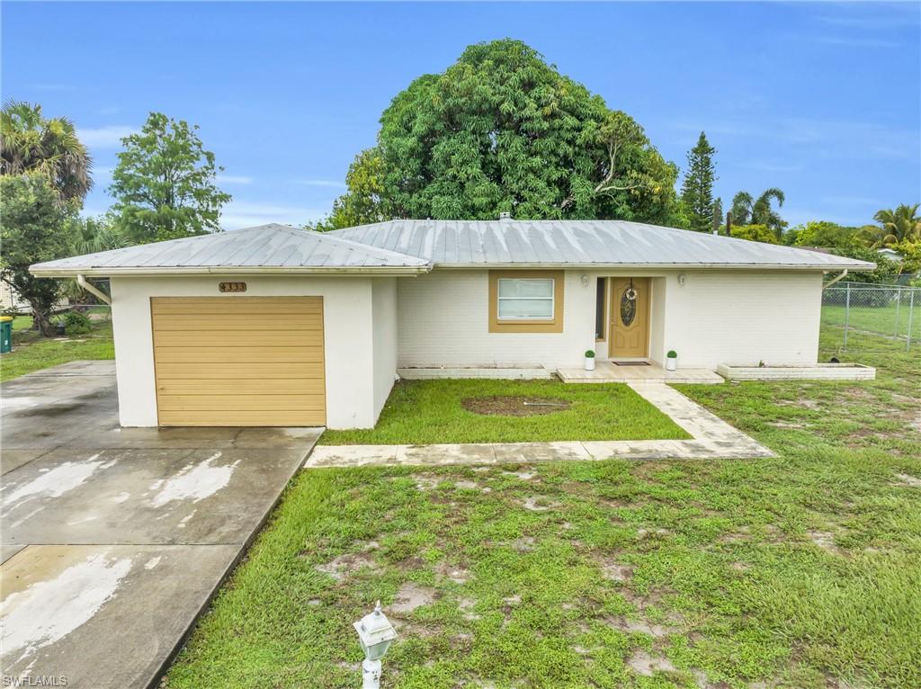 a view of a house with a yard