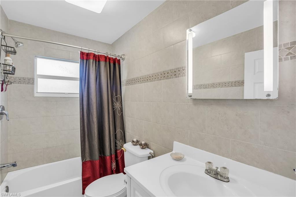 4333 20th Place Southwest Naples, FL 34116 - Photo 14 of 31 a bathroom with a sink toilet and shower