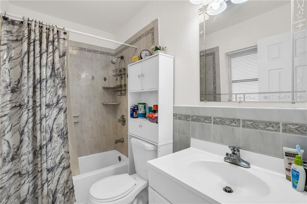 4333 20th Place Southwest Naples, FL 34116 - Photo 17 of 31 a bathroom with a sink toilet and shower