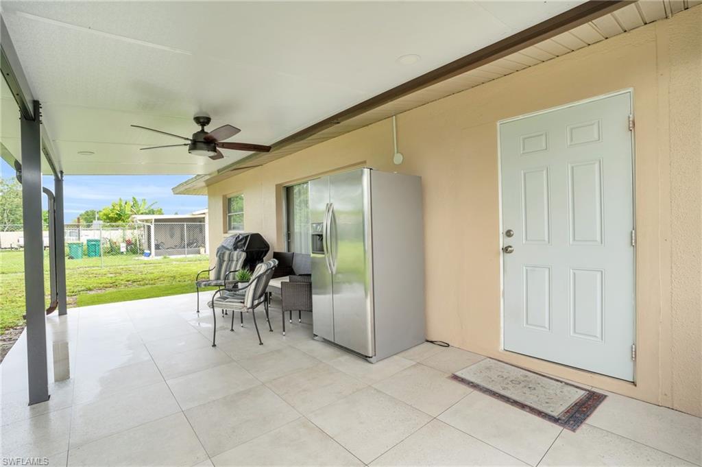 4333 20th Place Southwest Naples, FL 34116 - Photo 21 of 31 a dining room with furniture and a floor to ceiling window
