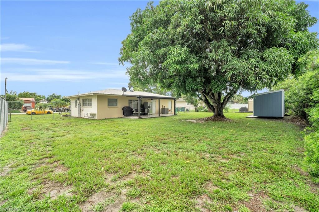 4333 20th Place Southwest Naples, FL 34116 - Photo 25 of 31 a front view of a house with a garden