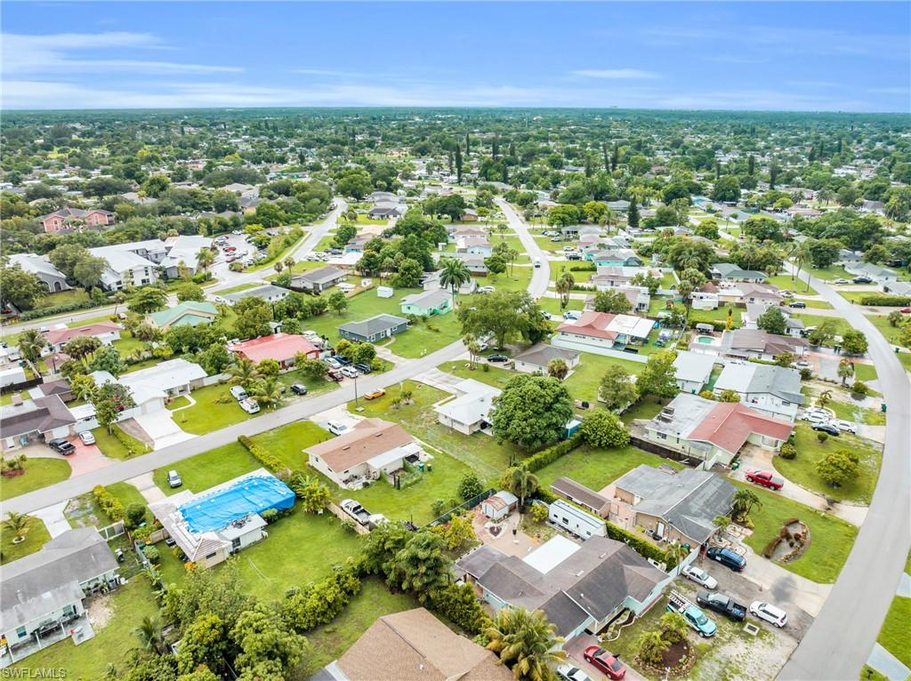 4333 20th Place Southwest Naples, FL 34116 - Photo 28 of 31 an aerial view of residential houses with outdoor space and trees