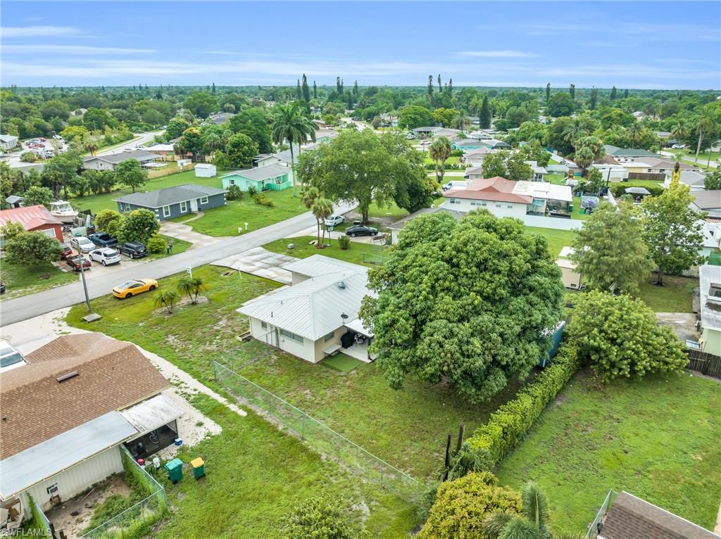 4333 20th Place Southwest Naples, FL 34116 - Photo 31 of 31 an aerial view of residential houses with outdoor space and trees all around