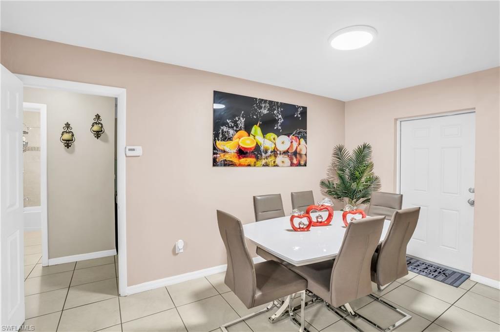 4333 20th Place Southwest Naples, FL 34116 - Photo 10 of 31 a view of a dining room with furniture
