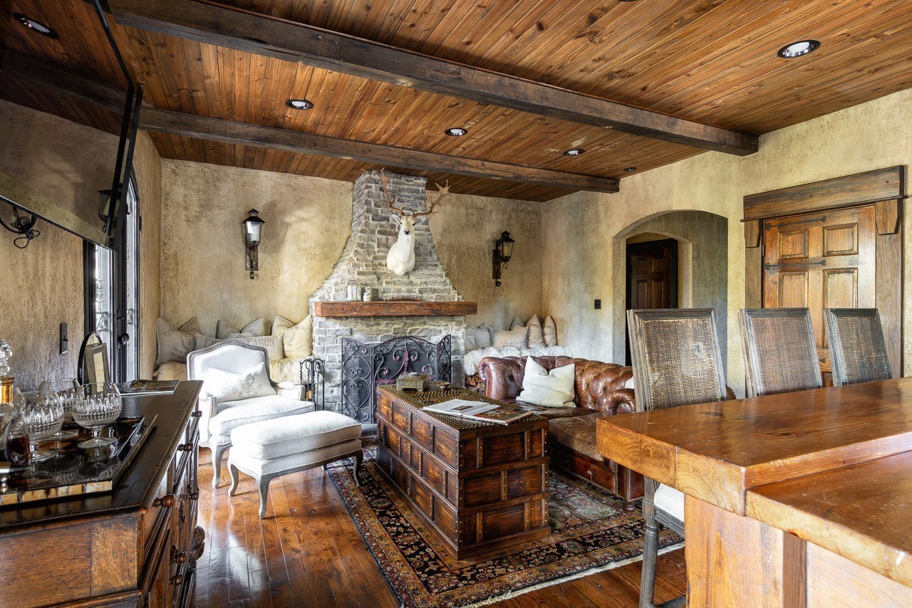 5551 Parker Branch Road Franklin, TN 37064 - Photo 24 of 67 a living room with fireplace furniture and a chandelier