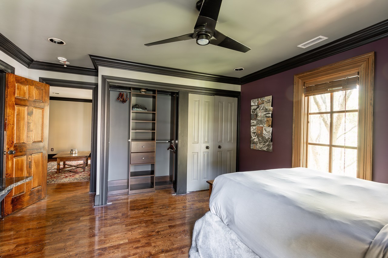 5551 Parker Branch Road Franklin, TN 37064 - Photo 41 of 67 a bedroom with a large bed and a window