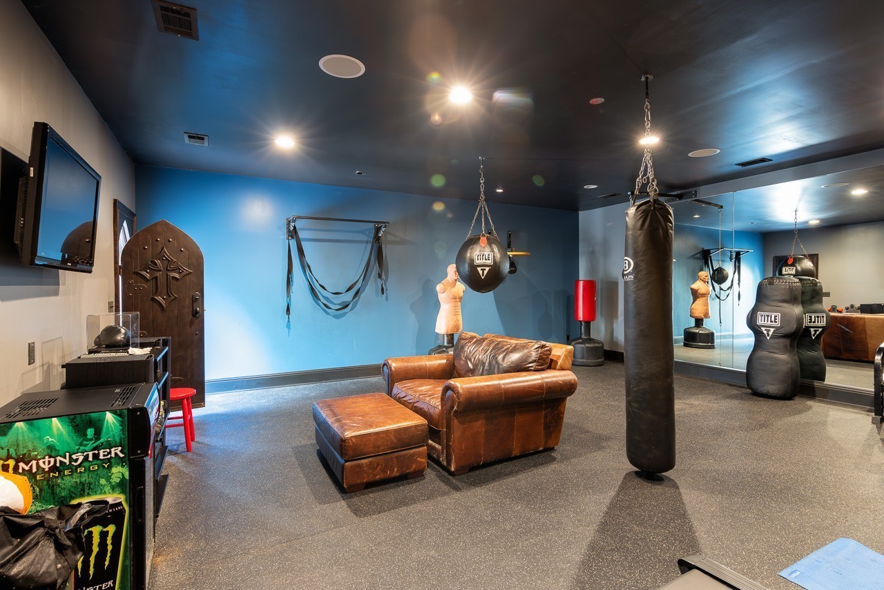 5551 Parker Branch Road Franklin, TN 37064 - Photo 61 of 67 a living room with furniture and a flat screen tv