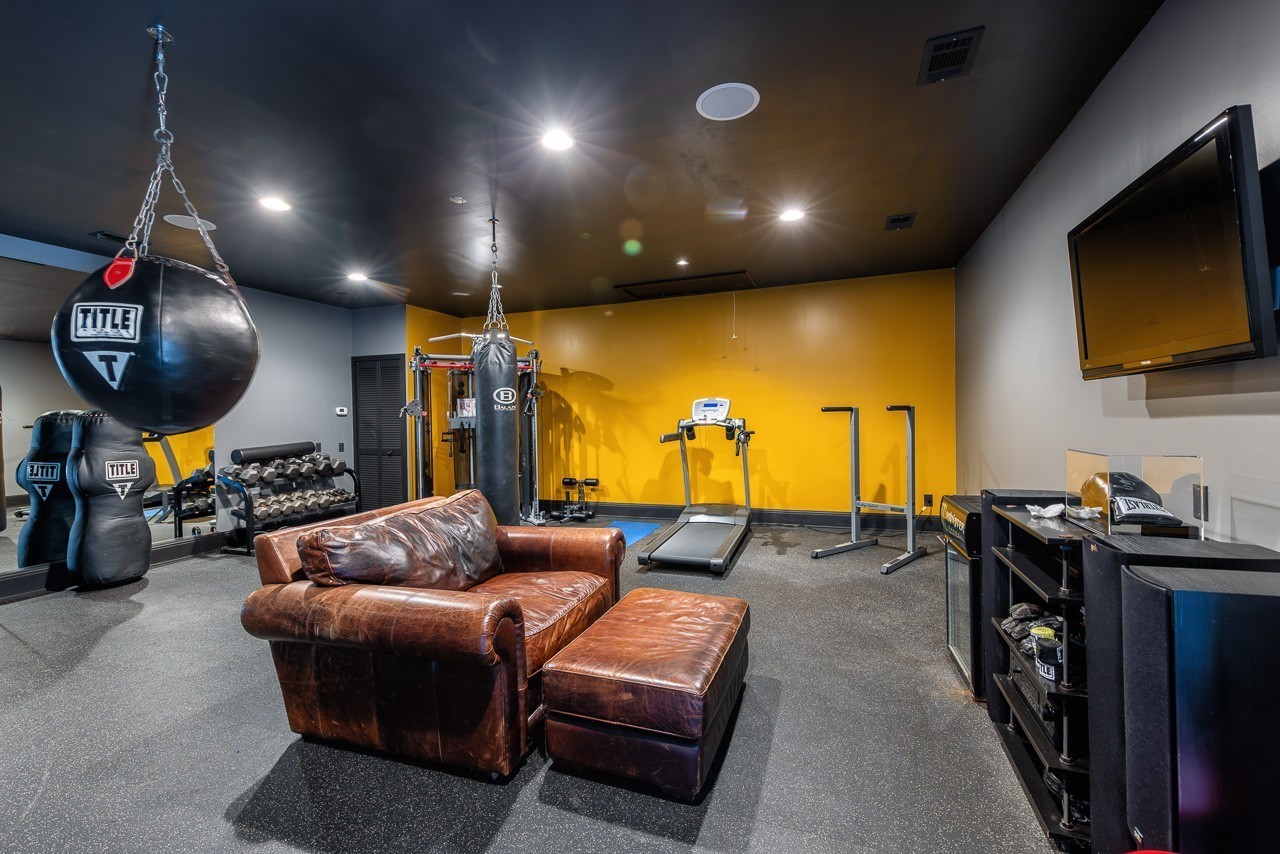 5551 Parker Branch Road Franklin, TN 37064 - Photo 62 of 67 a living room with furniture and a flat screen tv