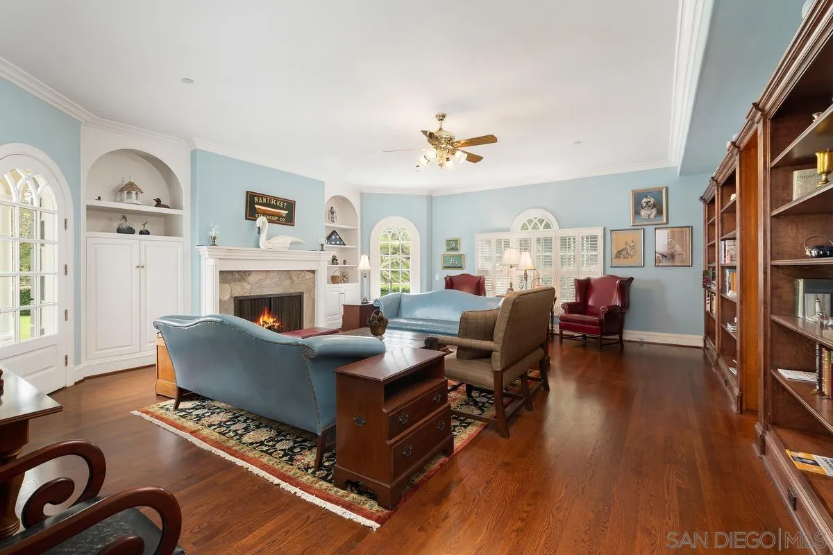 17032 Circa Oriente Rancho Santa Fe, CA 92067 - Photo 12 of 75 a living room with fireplace furniture and a wooden floor
