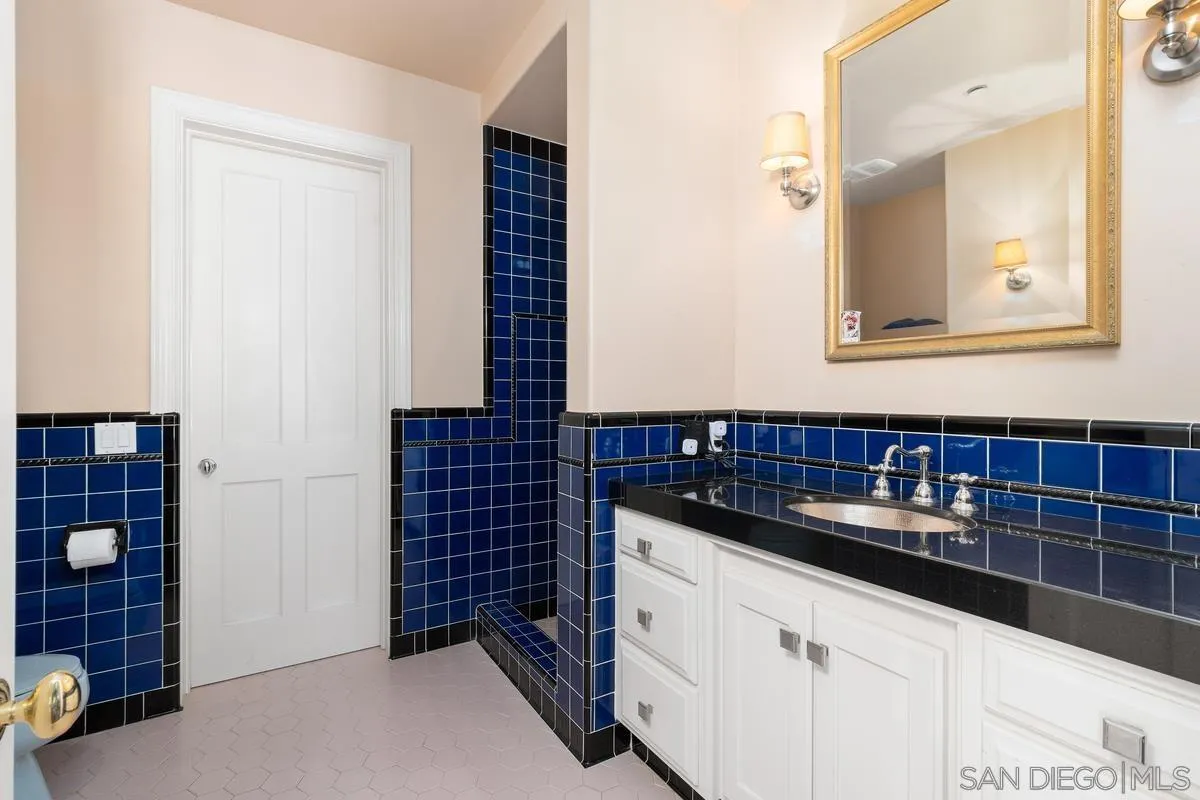 17032 Circa Oriente Rancho Santa Fe, CA 92067 - Photo 34 of 75 a bathroom with a sink and a mirror