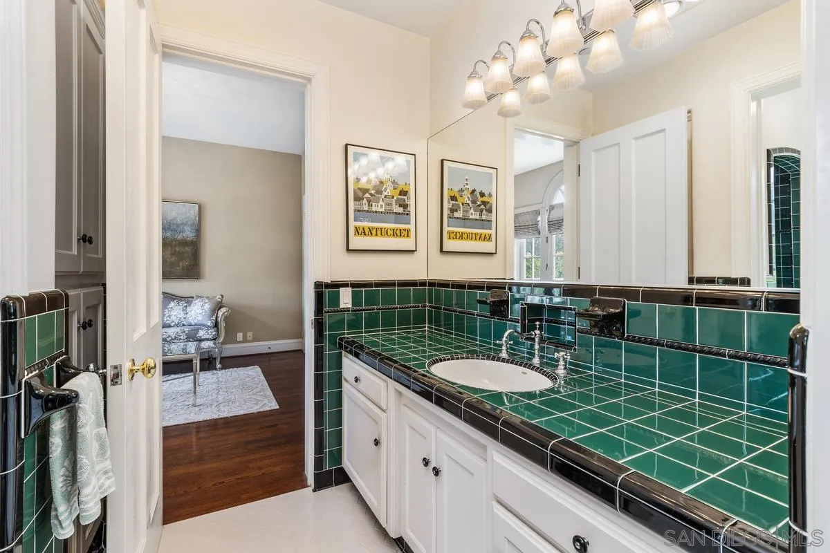 17032 Circa Oriente Rancho Santa Fe, CA 92067 - Photo 38 of 75 a bathroom with a sink a mirror and a shower