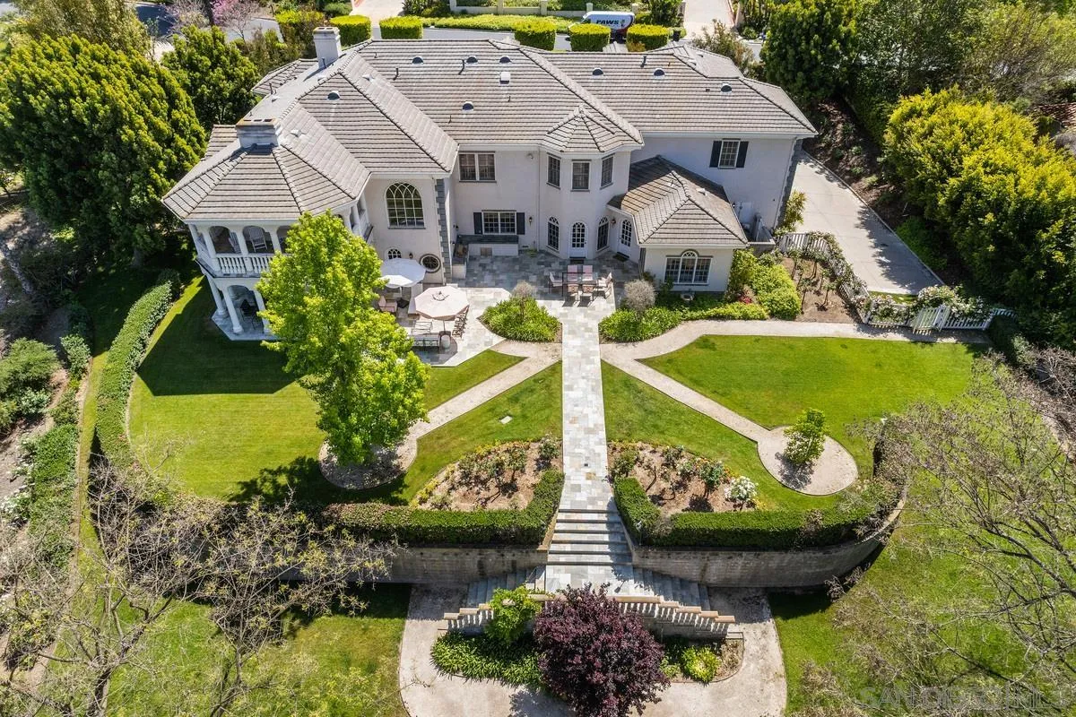 17032 Circa Oriente Rancho Santa Fe, CA 92067 - Photo 4 of 75 an aerial view of a house with a garden and lake view