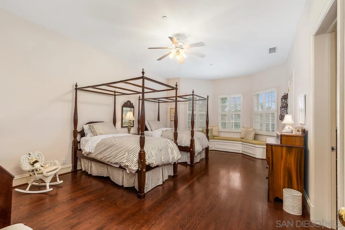 17032 Circa Oriente Rancho Santa Fe, CA 92067 - Photo 43 of 75 a bed room with a bed and a chandelier