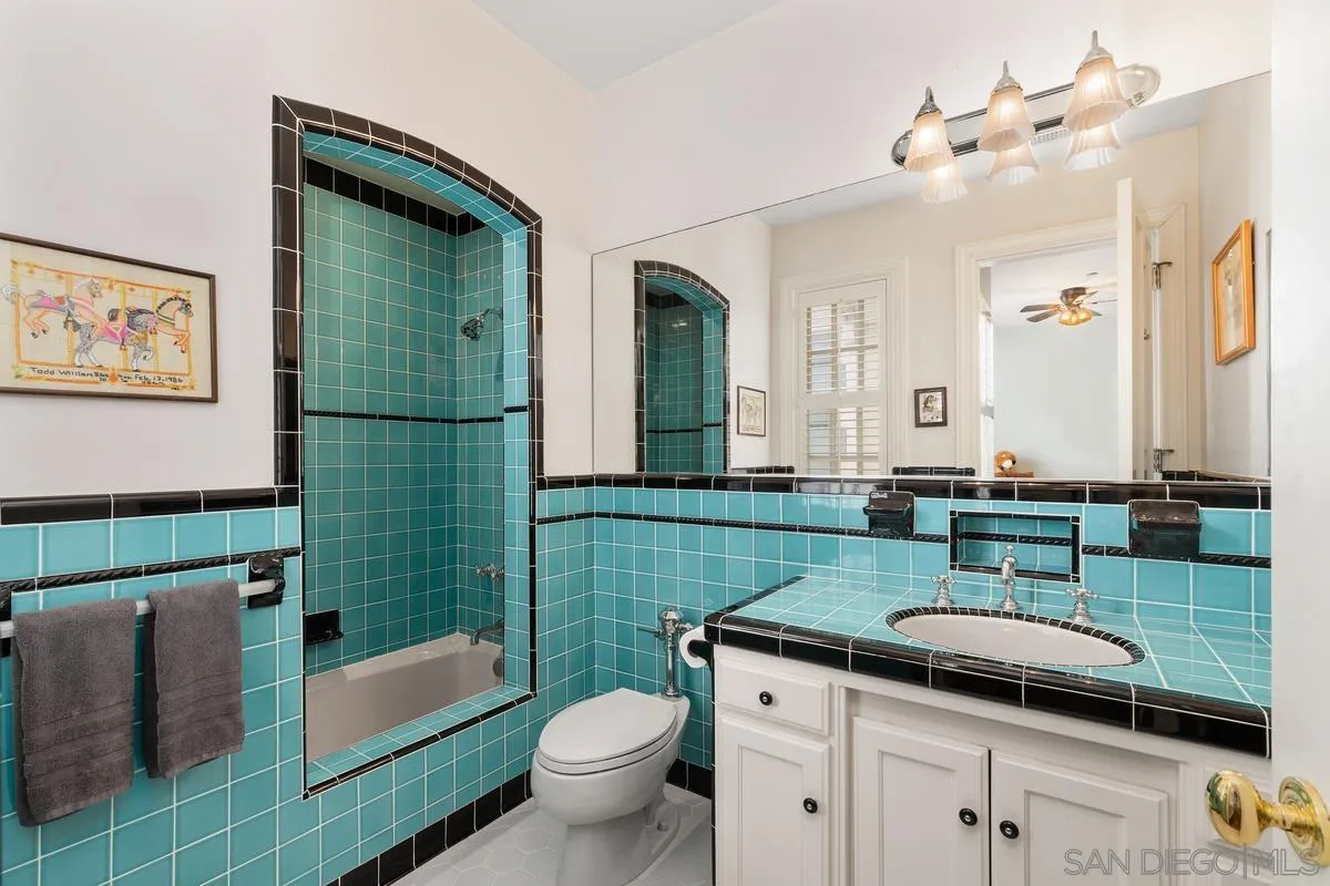 17032 Circa Oriente Rancho Santa Fe, CA 92067 - Photo 45 of 75 a bathroom with a granite countertop toilet sink and mirror