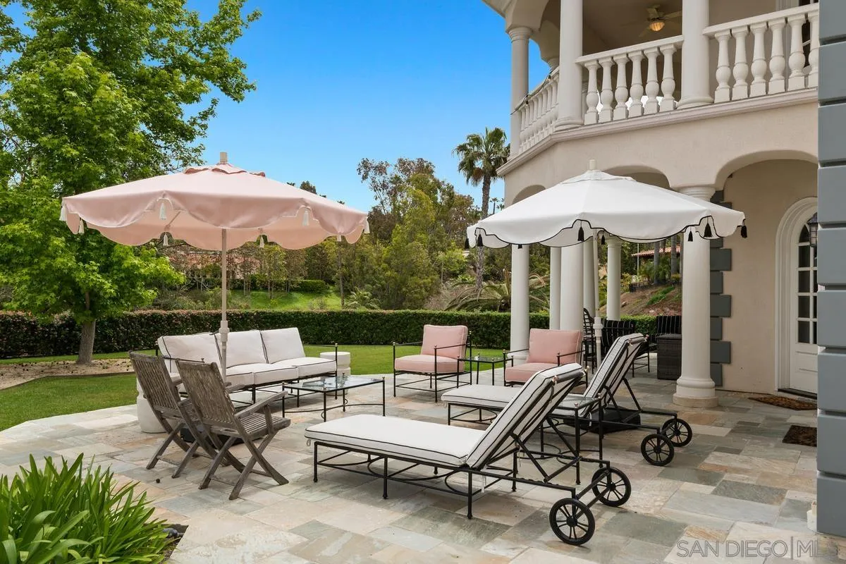 17032 Circa Oriente Rancho Santa Fe, CA 92067 - Photo 52 of 75 a view of a patio with a table chairs and a barbeque