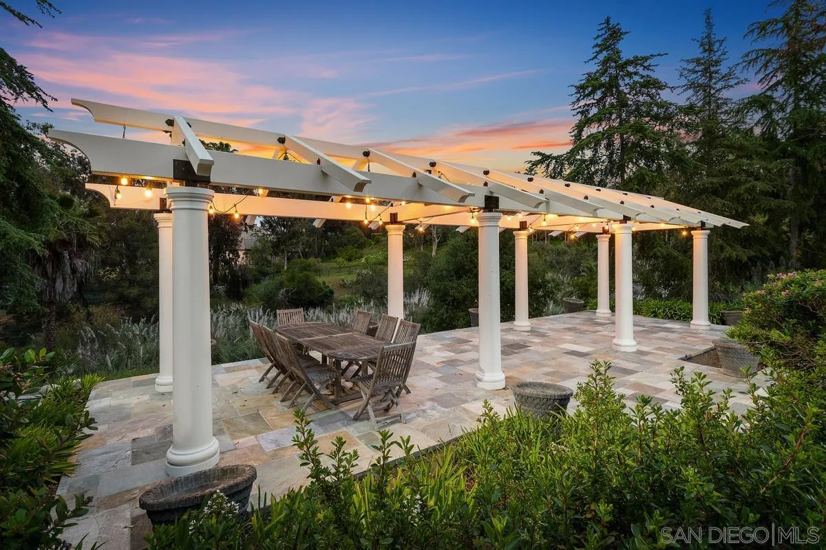17032 Circa Oriente Rancho Santa Fe, CA 92067 - Photo 56 of 75 a view of a patio with table and chairs potted plants