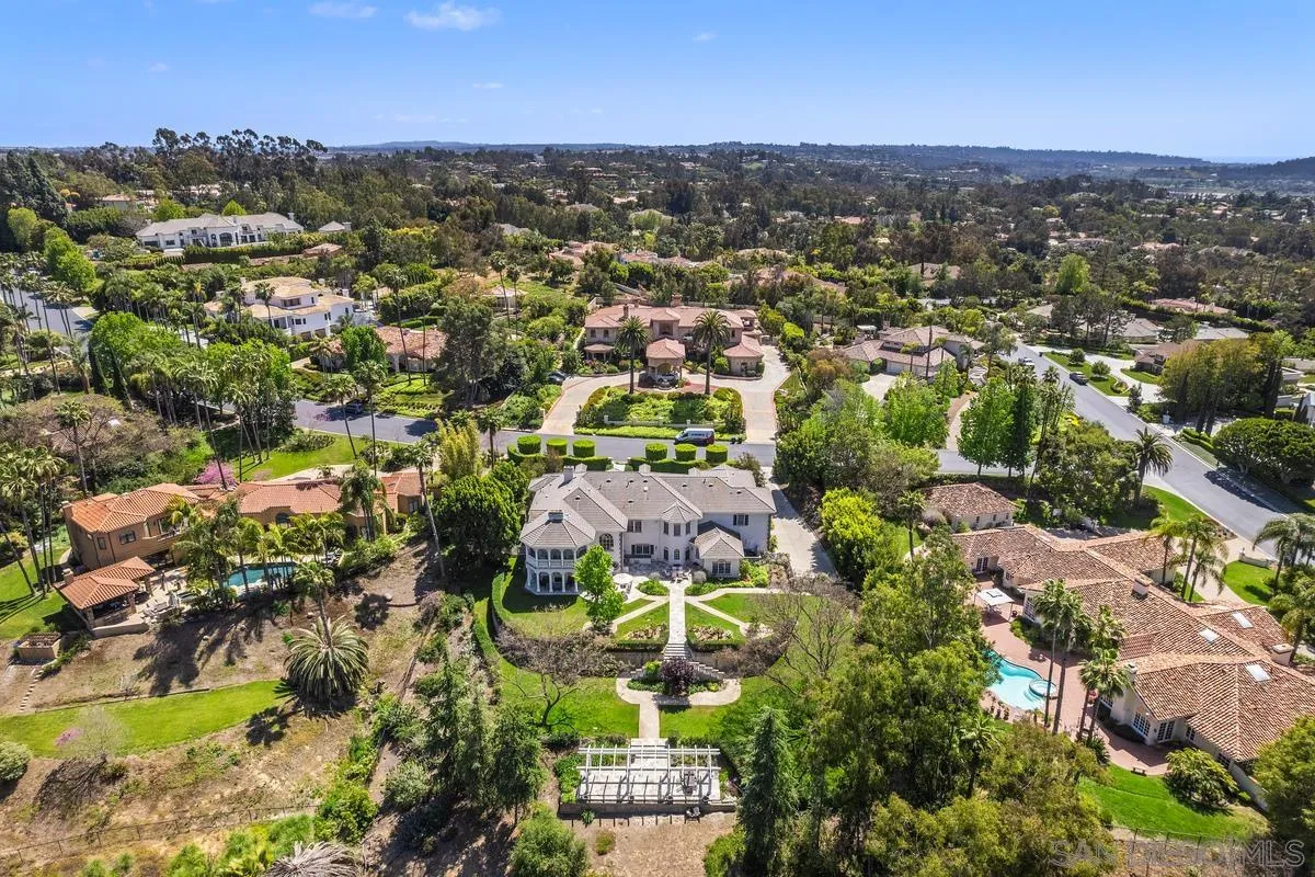 17032 Circa Oriente Rancho Santa Fe, CA 92067 - Photo 59 of 75 an aerial view of residential houses with outdoor space and trees