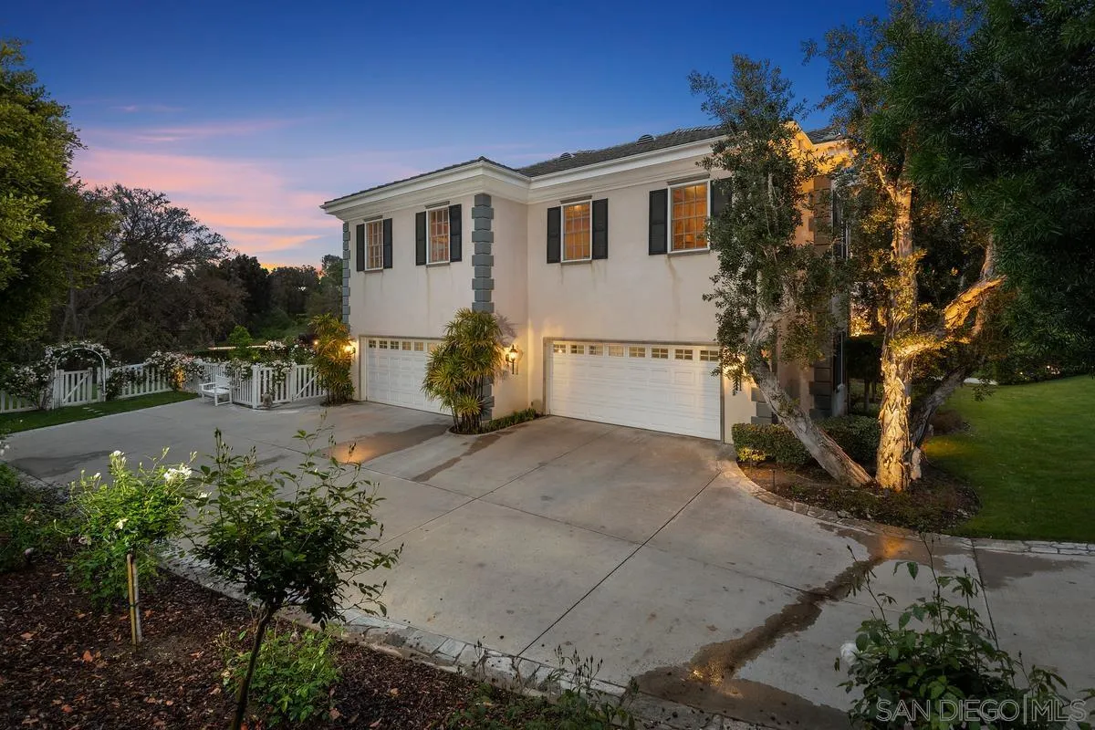 17032 Circa Oriente Rancho Santa Fe, CA 92067 - Photo 61 of 75 a view of a white house with a yard