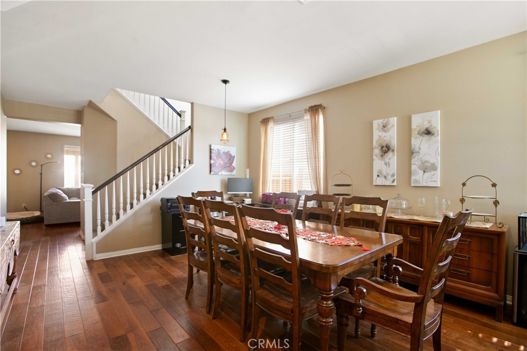 3866 Obsidian Road San Bernardino, CA 92407 - Photo 11 of 64 a view of a a dining room with furniture window and wooden floor