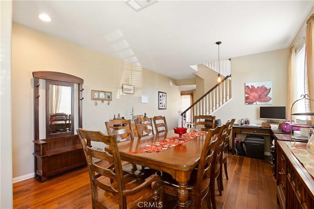 3866 Obsidian Road San Bernardino, CA 92407 - Photo 12 of 64 a view of a dining room with furniture and wooden floor