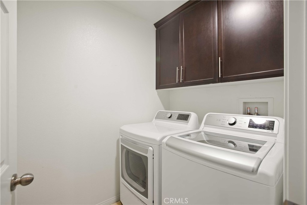 3866 Obsidian Road San Bernardino, CA 92407 - Photo 30 of 64 a utility room with dryer and washer