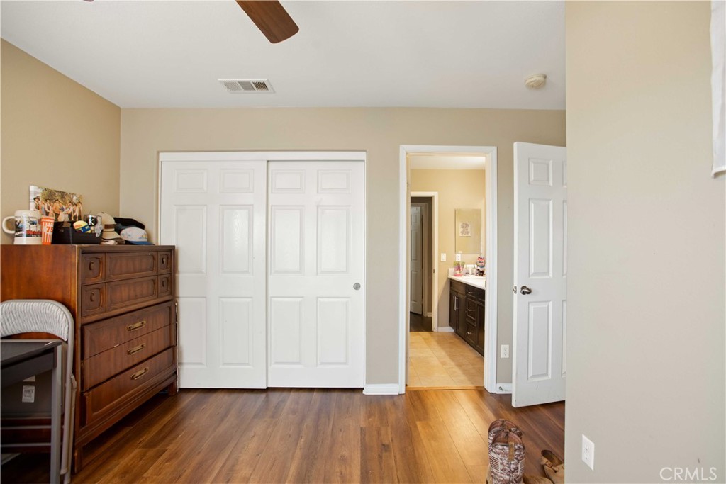 3866 Obsidian Road San Bernardino, CA 92407 - Photo 32 of 64 a view of a storage & utility room with closet wooden floor and windows