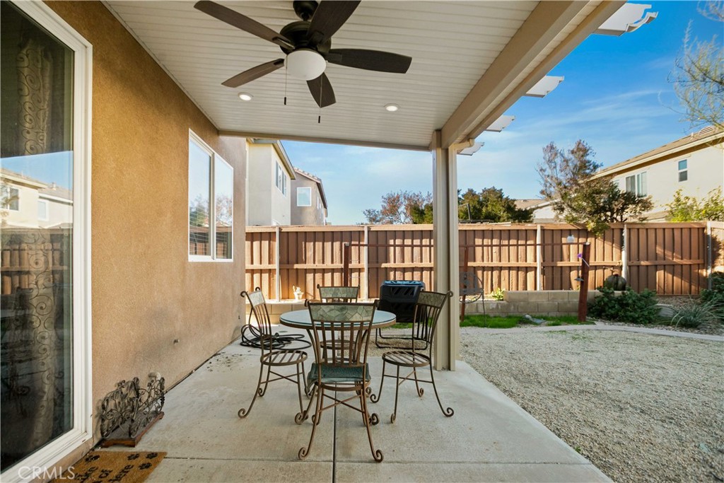 3866 Obsidian Road San Bernardino, CA 92407 - Photo 39 of 64 a view of a patio with table and chairs and potted plants