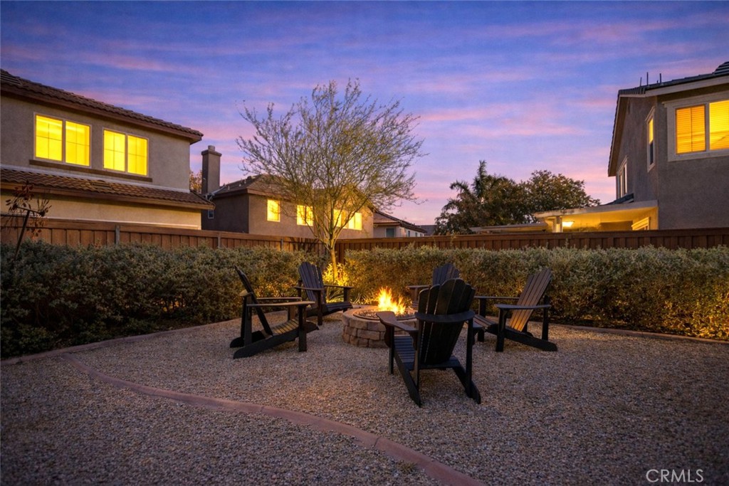 3866 Obsidian Road San Bernardino, CA 92407 - Photo 4 of 64 a view of a patio with table and chairs and potted plants