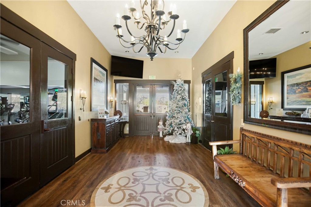 3866 Obsidian Road San Bernardino, CA 92407 - Photo 54 of 64 View of the foyer that leads to a workout room or to the meeting room that can be rented by the residence for a low fee.