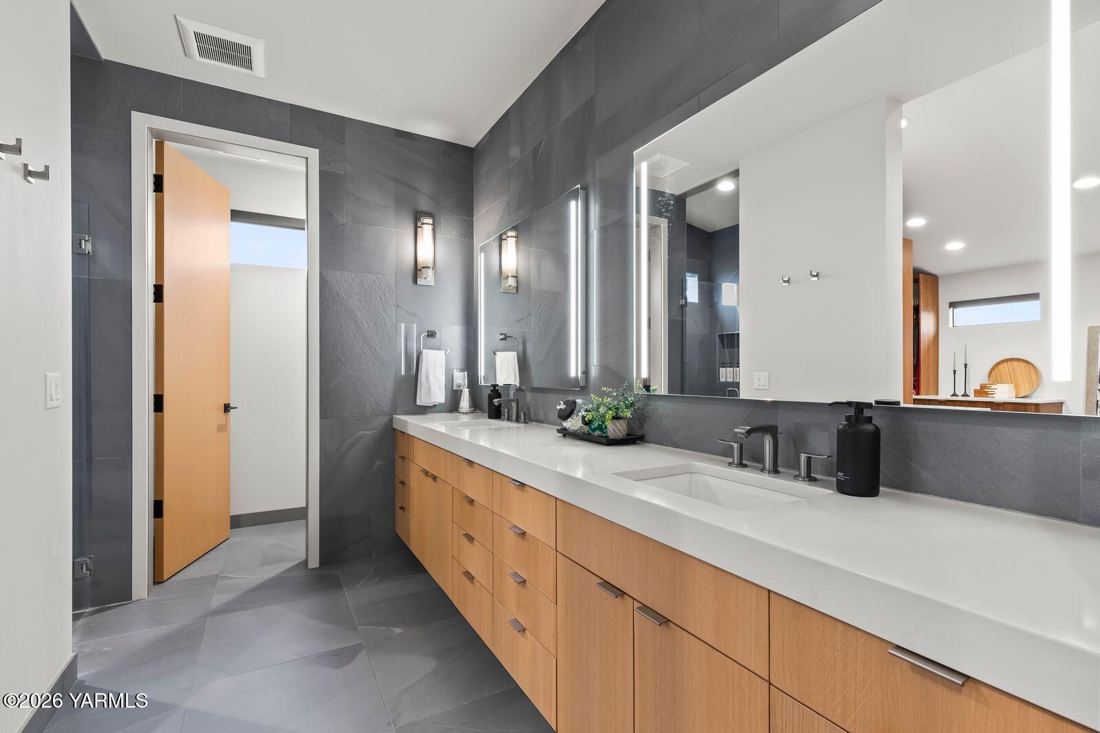 13990 Marble Road Yakima, WA 98908 - Photo 21 of 60 a bathroom with a granite countertop sink mirror and vanity
