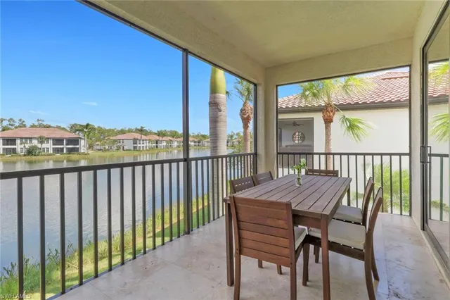 a view of a two chairs and table in the balcony