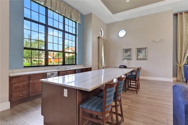 a view of a dining room with furniture and a window
