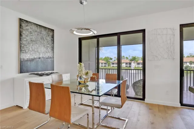a dining room with furniture a rug and wooden floor