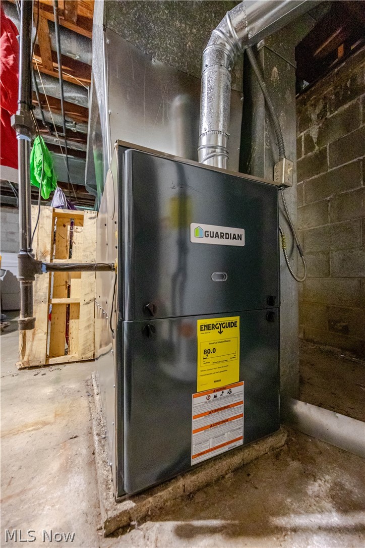 3825 Mayfield Road Cleveland Heights, OH 44121 - Photo 24 of 27 Guardian brand HVAC unit with metal ductwork, concrete flooring, and exposed ceiling joists