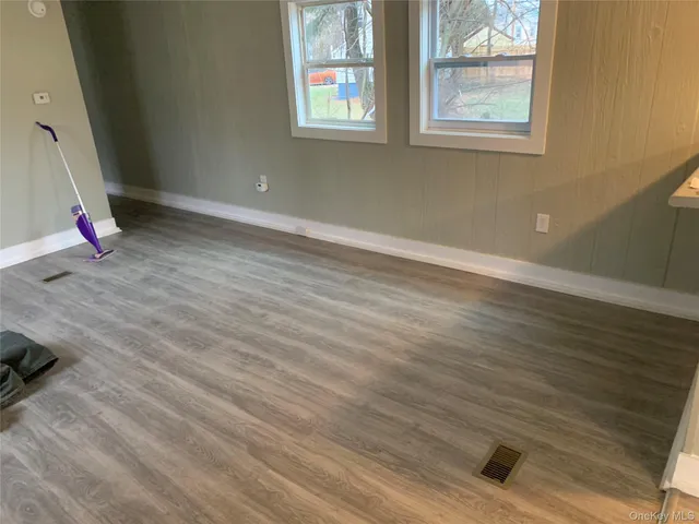 a view of livingroom and hardwood floor