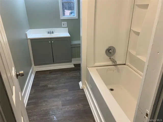 view of a bathroom with a sink and a tub