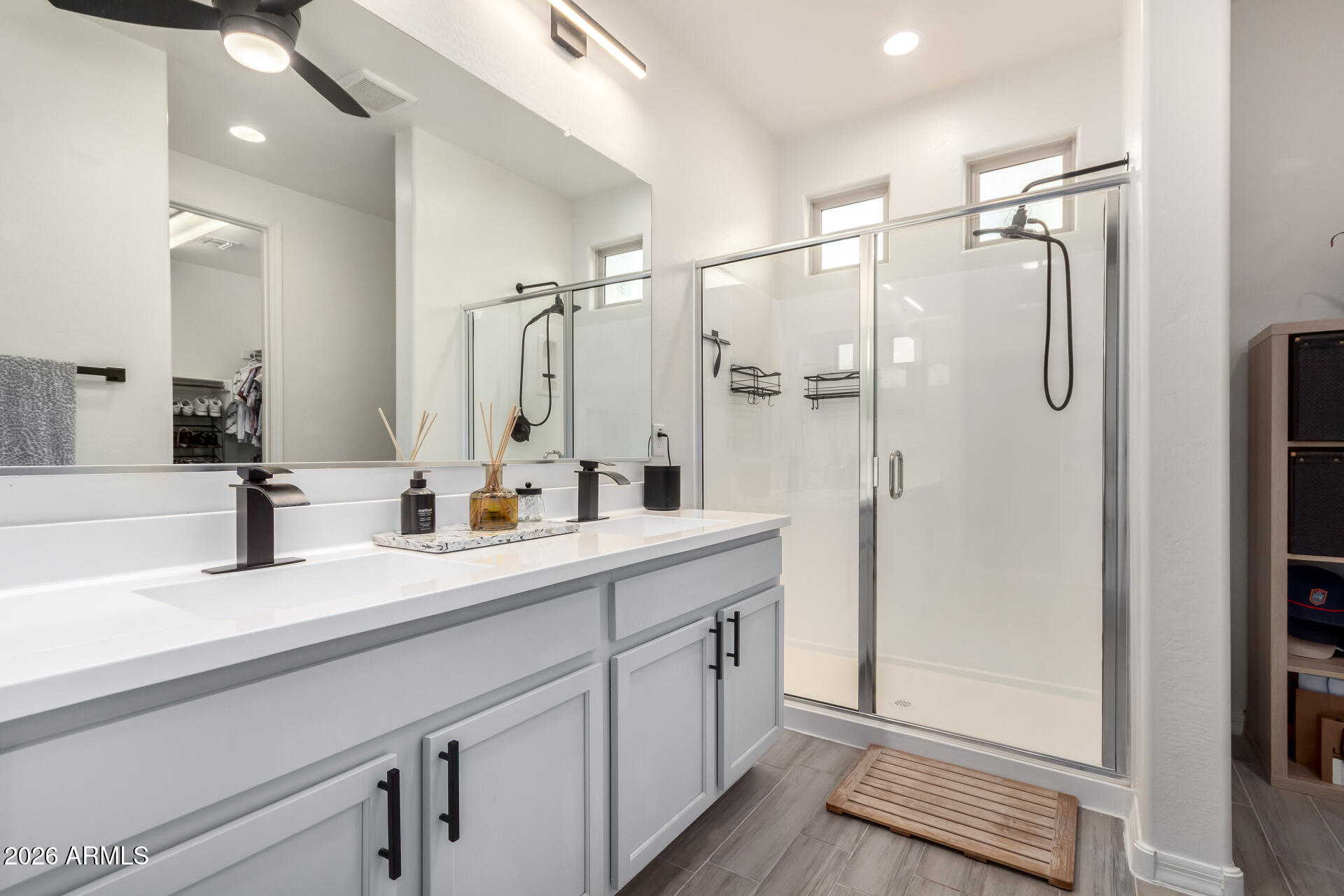 21057 West Almeria Road Buckeye, AZ 85396 - Photo 15 of 49 a bathroom with a double vanity sink mirror and double