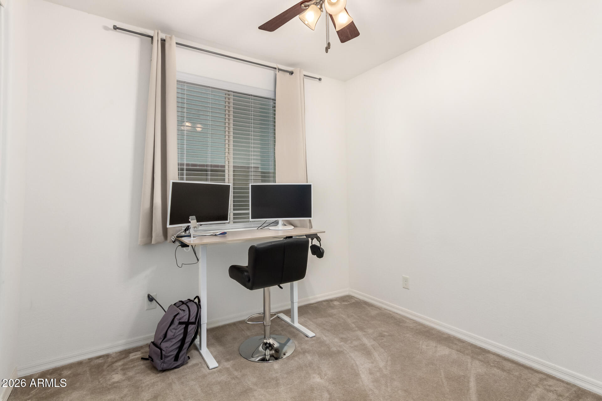 21057 West Almeria Road Buckeye, AZ 85396 - Photo 20 of 49 a view of a workspace with furniture