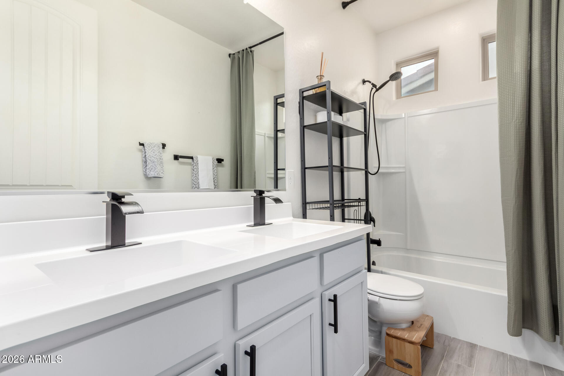 21057 West Almeria Road Buckeye, AZ 85396 - Photo 22 of 49 a bathroom with a sink a toilet and shower