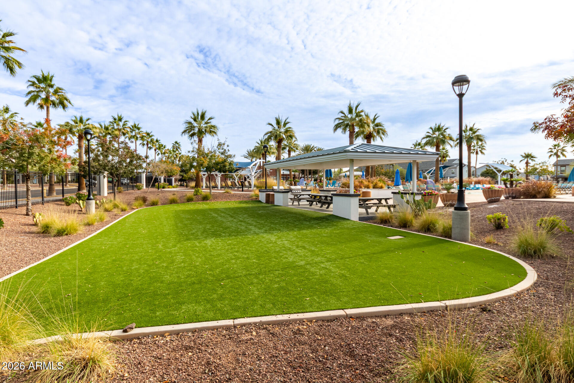 21057 West Almeria Road Buckeye, AZ 85396 - Photo 36 of 49 a view of a swimming pool and a yard