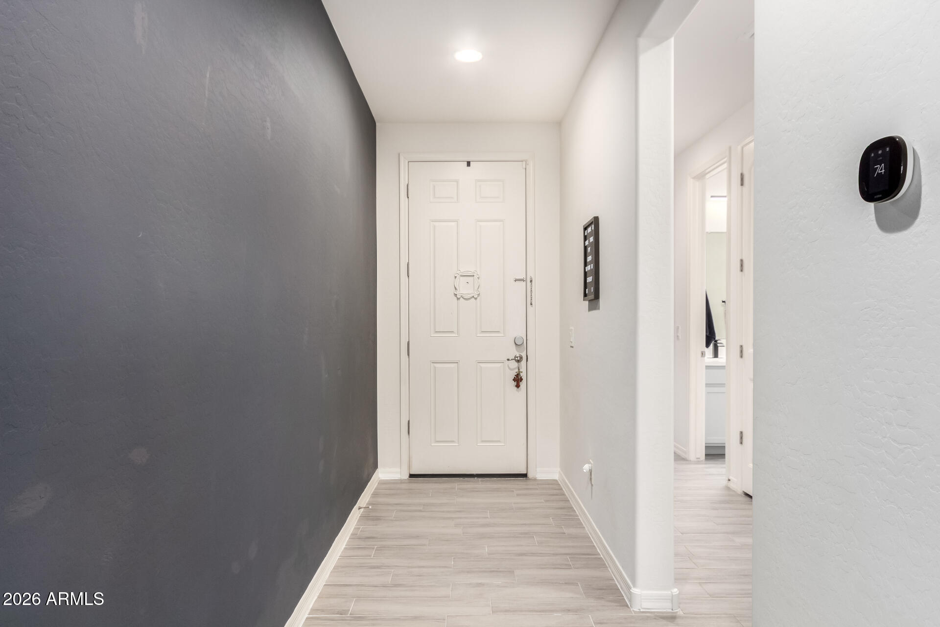 21057 West Almeria Road Buckeye, AZ 85396 - Photo 4 of 49 a view of a bathroom with a shower