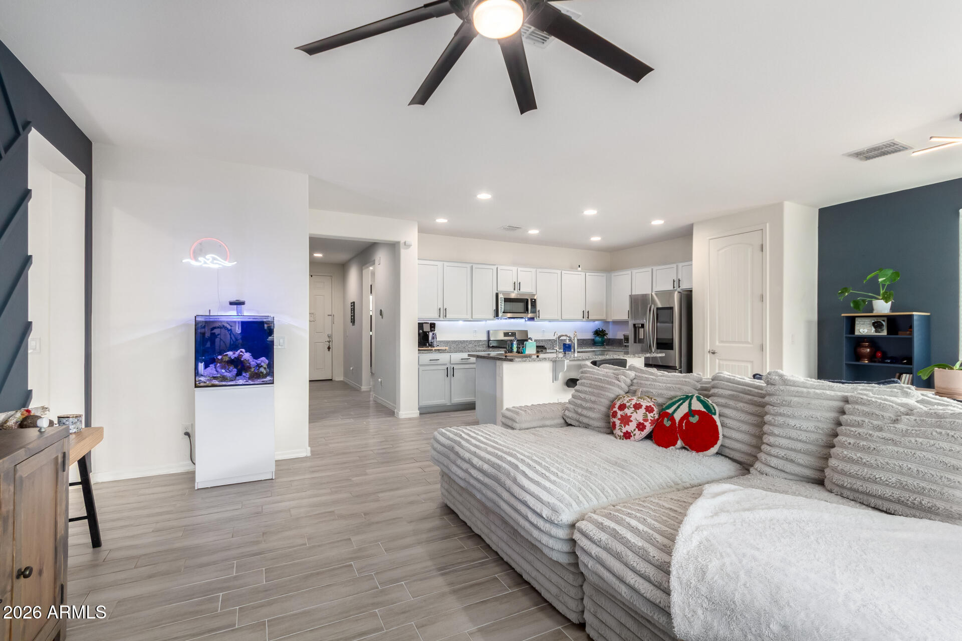 21057 West Almeria Road Buckeye, AZ 85396 - Photo 7 of 49 a living room with furniture and kitchen view